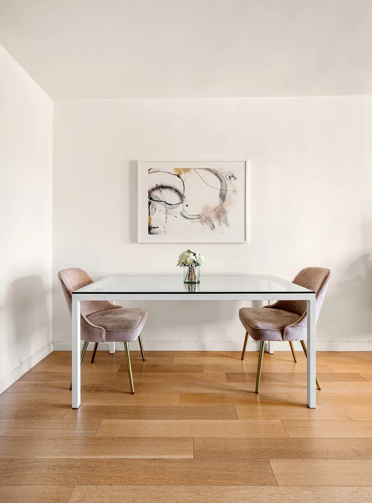 a view of a room with furniture and wooden floor