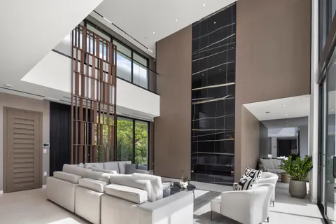 a living room with furniture a window and a fireplace