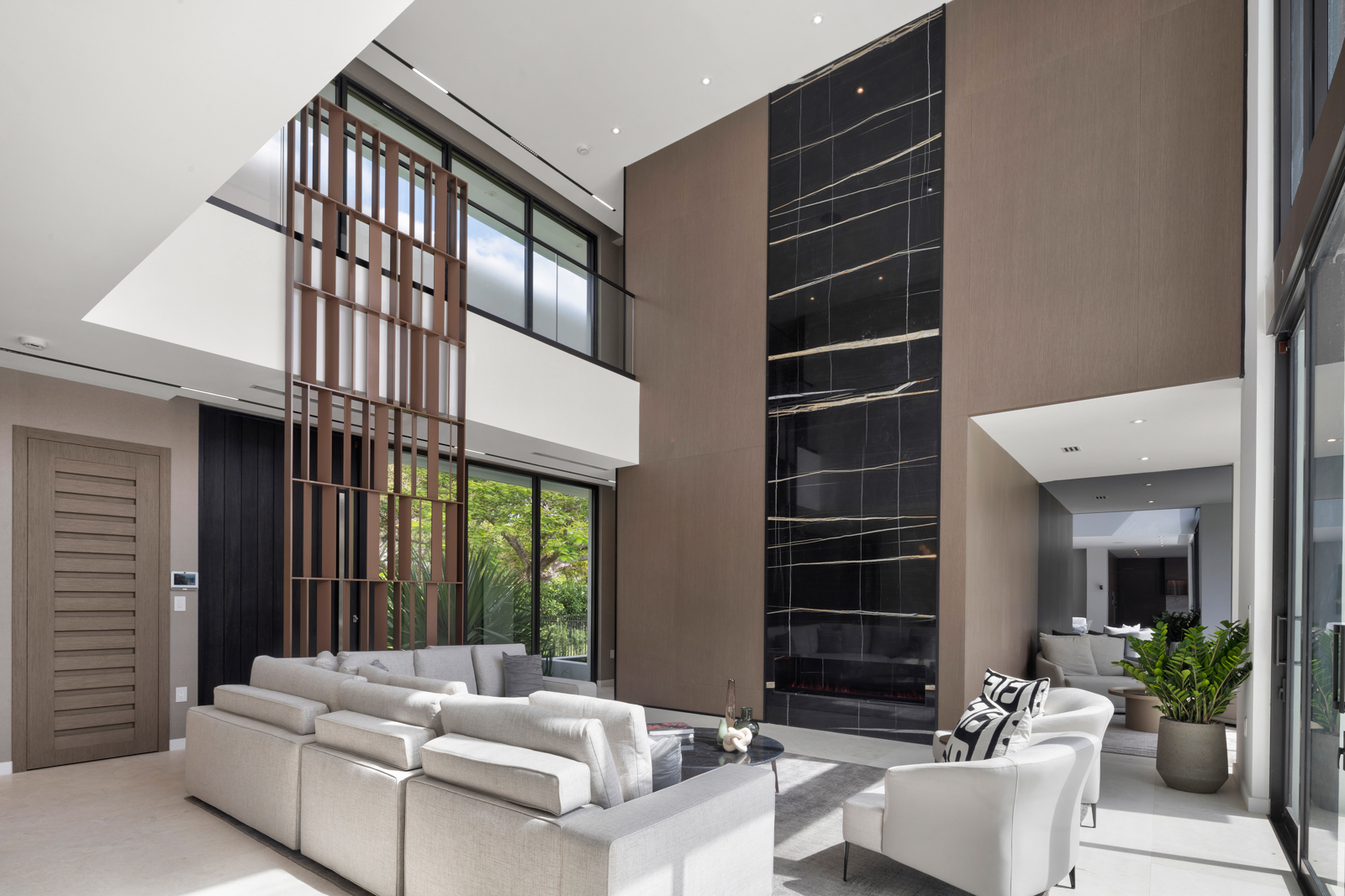 6920 Southwest 124th Street Pinecrest, FL 33156 - Photo 14 of 48 a living room with furniture a window and a fireplace