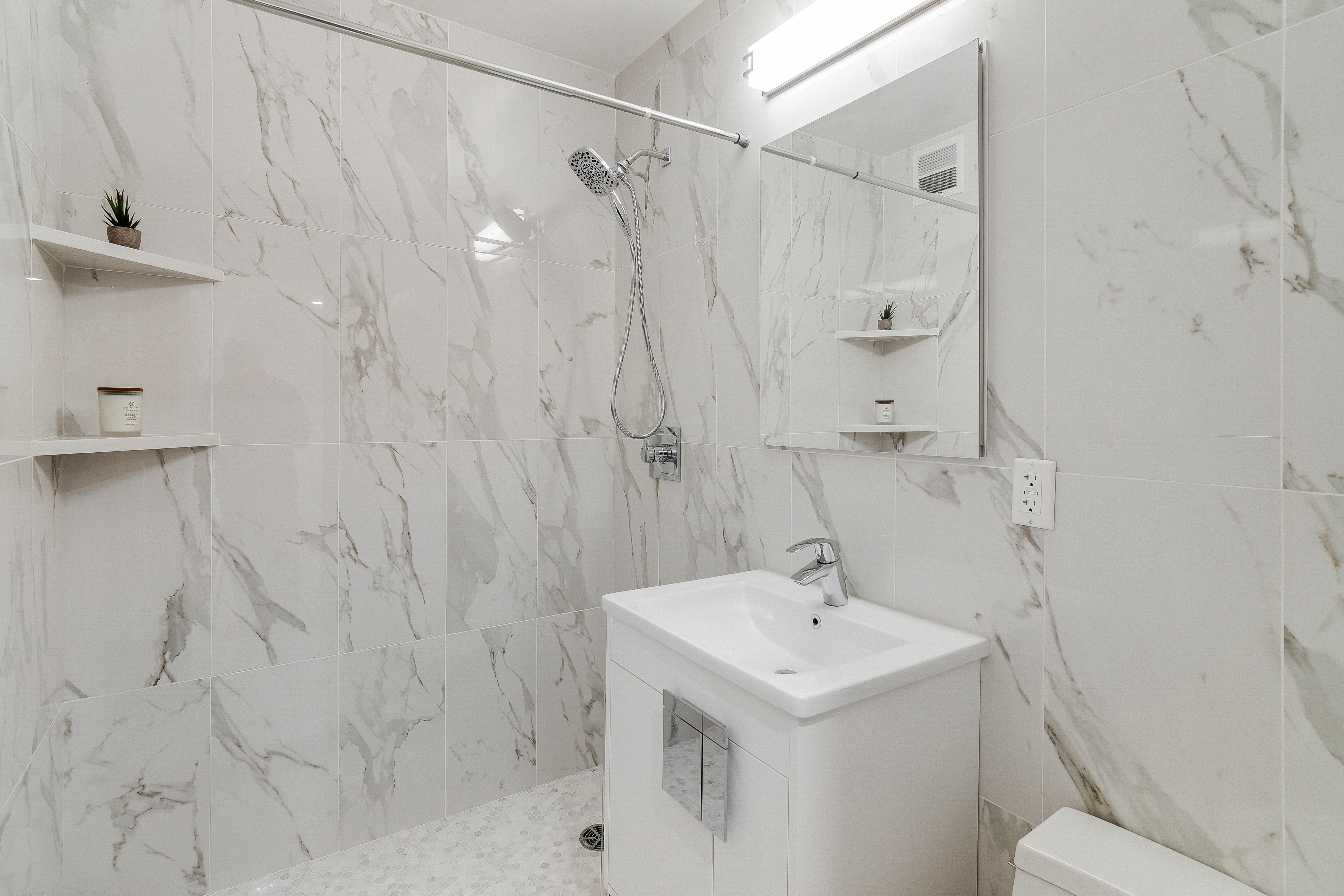 4455 Douglas Avenue, Unit 8A Bronx, NY 10471 - Photo 9 of 22 a bathroom with a sink a toilet and shower