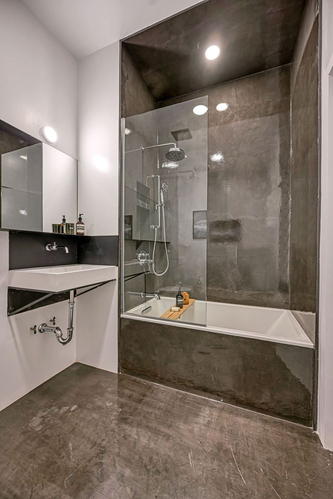 459 Harman Street, Unit 1 Manhattan, NY 10026 - Photo 9 of 17 a bathroom with a bathtub and a sink