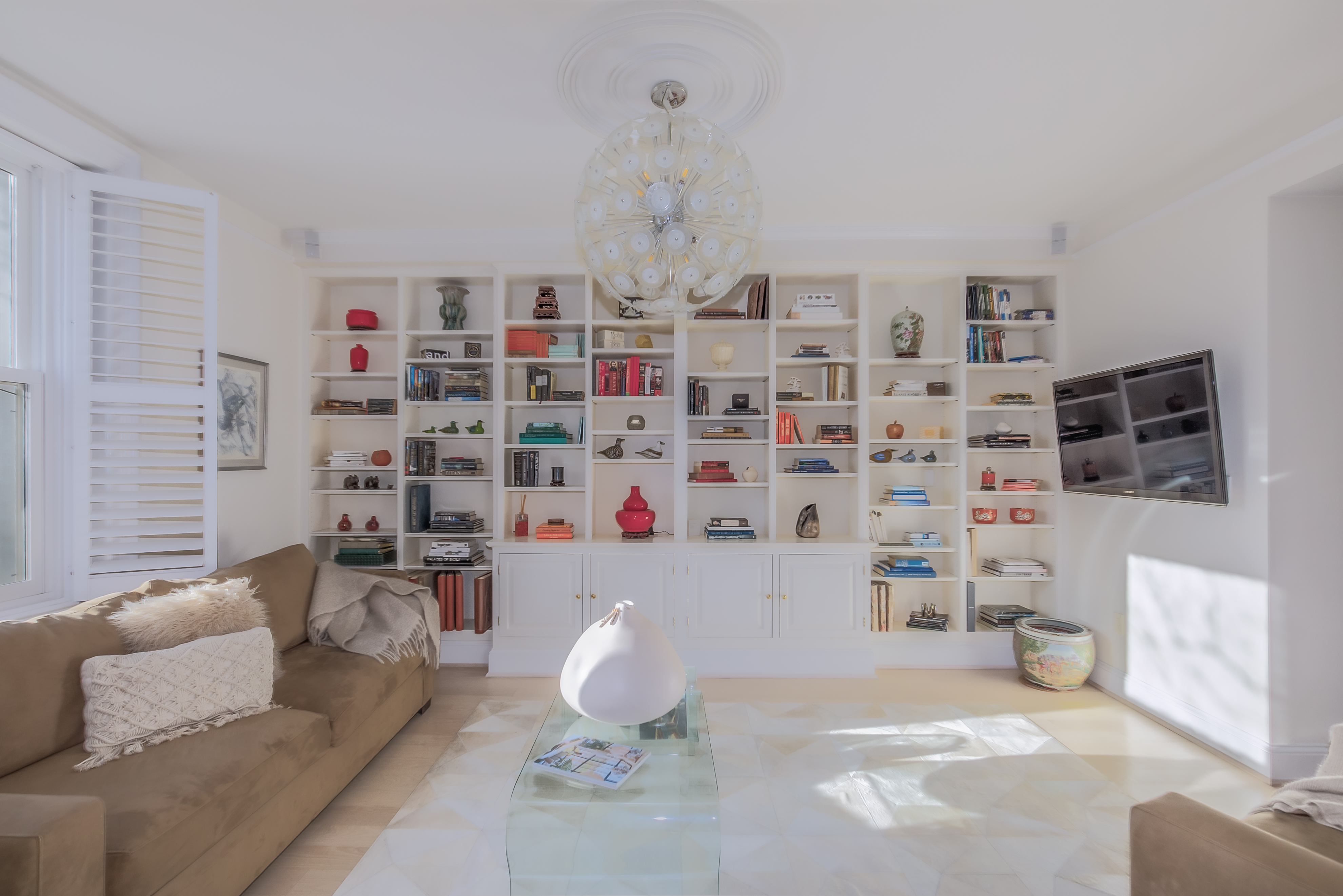 2022 Columbia Road Northwest, Unit 202 Washington, DC 20009 - Photo 6 of 15 a living room with furniture and a book shelf