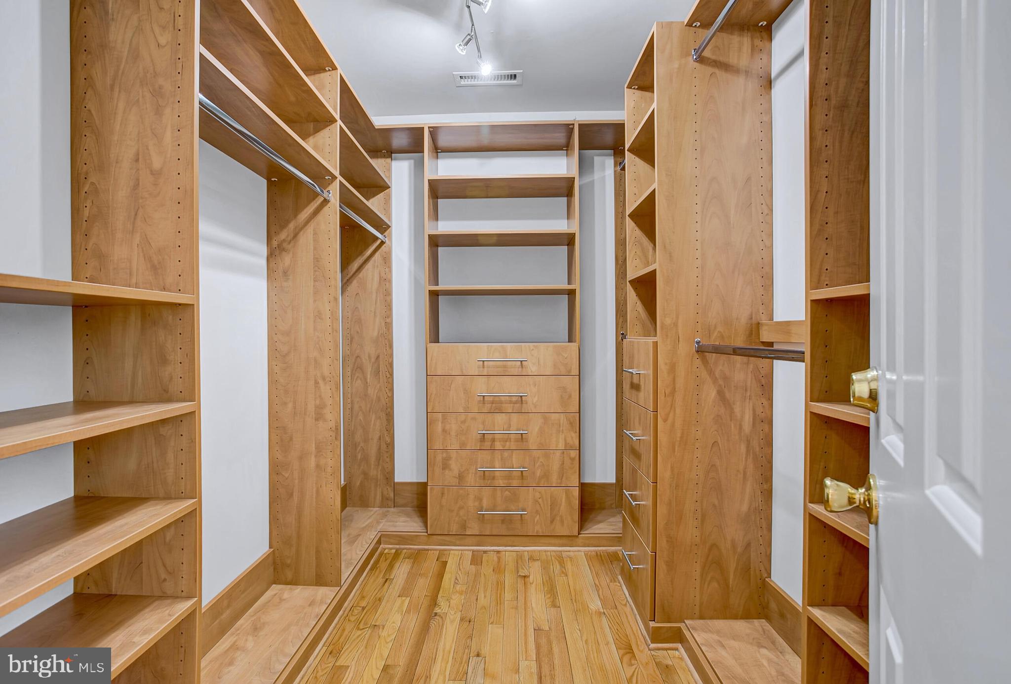 4709 Foxhall Crescent Northwest Washington, DC 20007 - Photo 32 of 57 a view of walk in closet with empty racks
