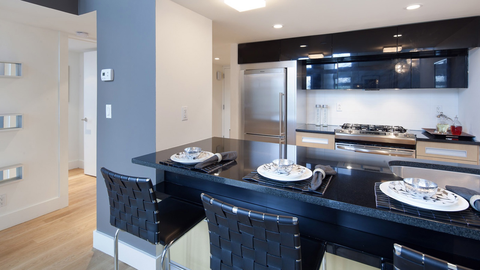 105 Grand Avenue, Unit 4L Brooklyn, NY 11205 - Photo 2 of 10 a kitchen with a table and chairs in it