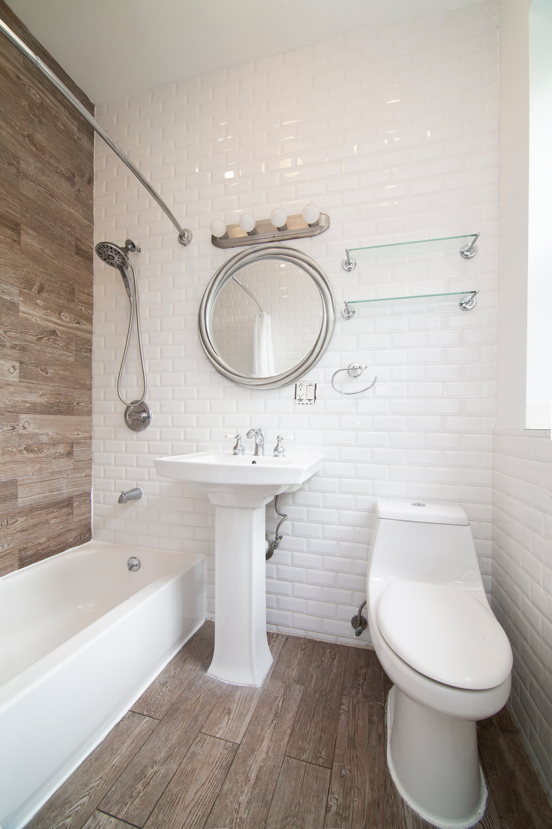 900 Lafayette Avenue Brooklyn, NY 11221 - Photo 12 of 13 a bathroom with a sink a toilet and bathtub