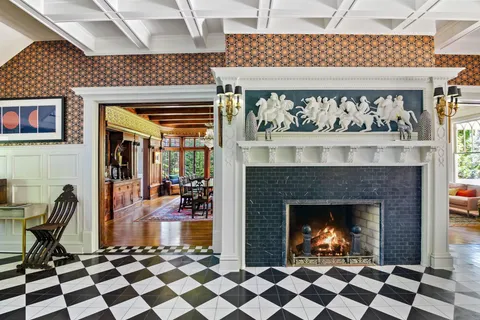 a view of a fireplace and chair in a room