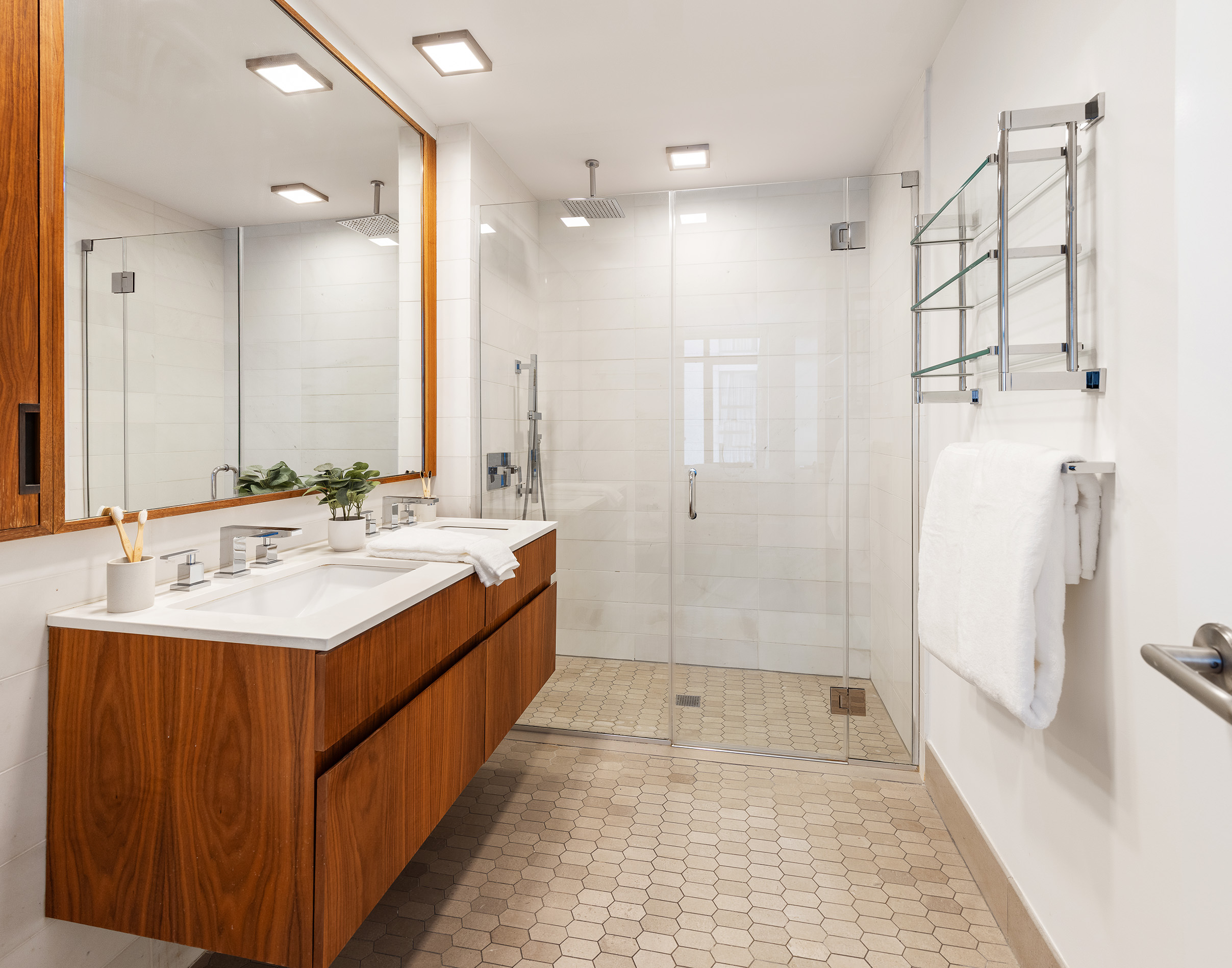 319 Schermerhorn Street, Unit 11B Brooklyn, NY 11217 - Photo 8 of 15 a bathroom with a double vanity sink mirror double and shower
