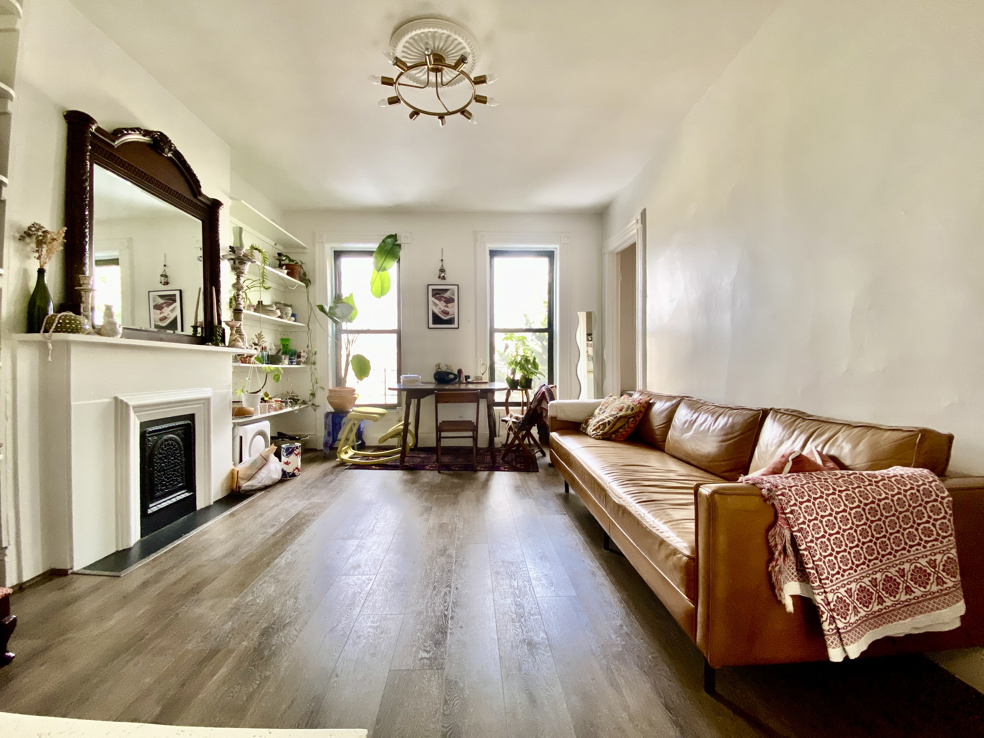 441 MacDonough Street, Unit 3 Brooklyn, NY 11233 - Photo 1 of 6 a living room with furniture fireplace and window