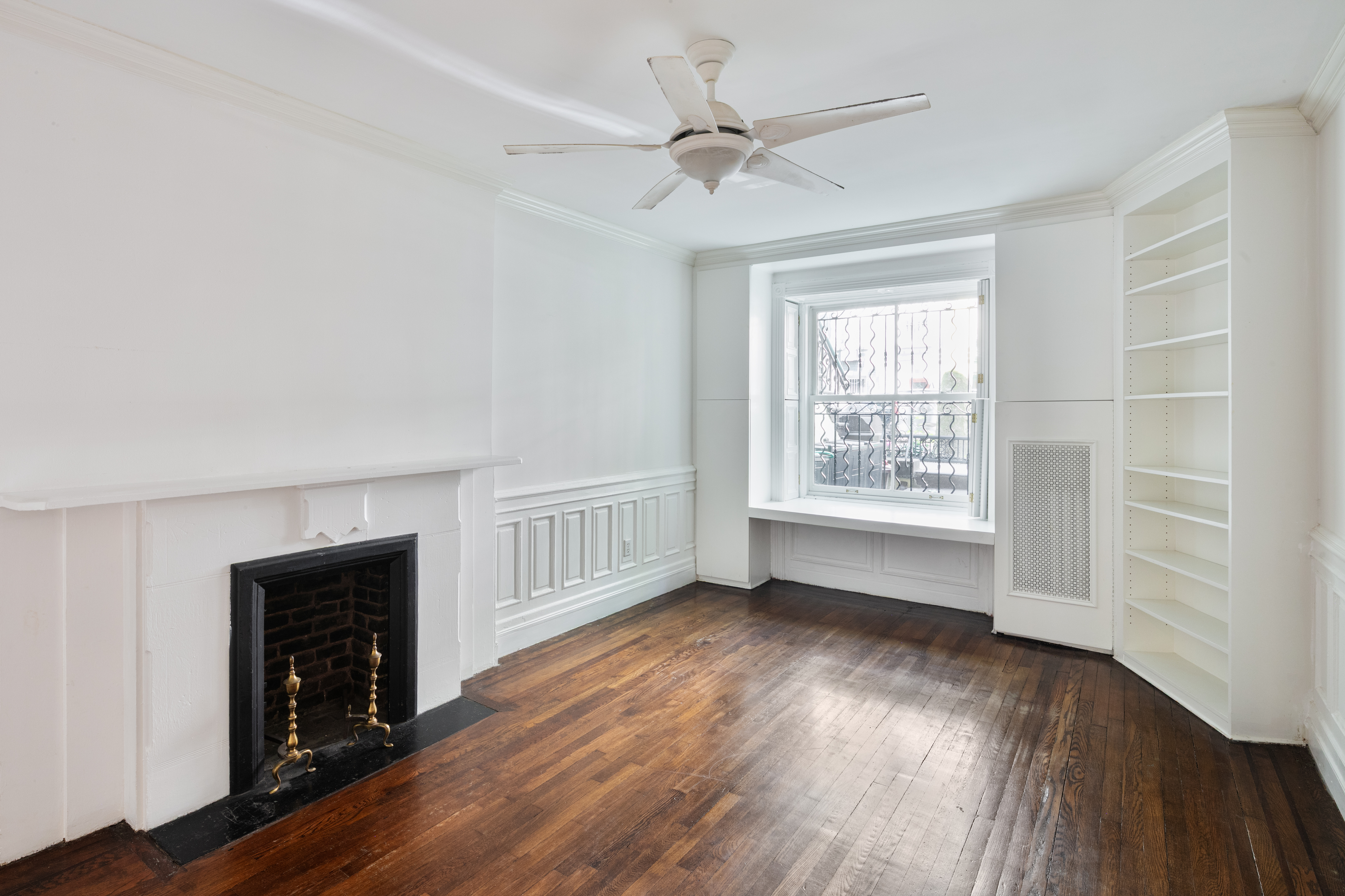 112 West 78th Street, Unit PARLOR Manhattan, NY 10024 - Photo 26 of 37 wooden floor in an empty room with a fireplace