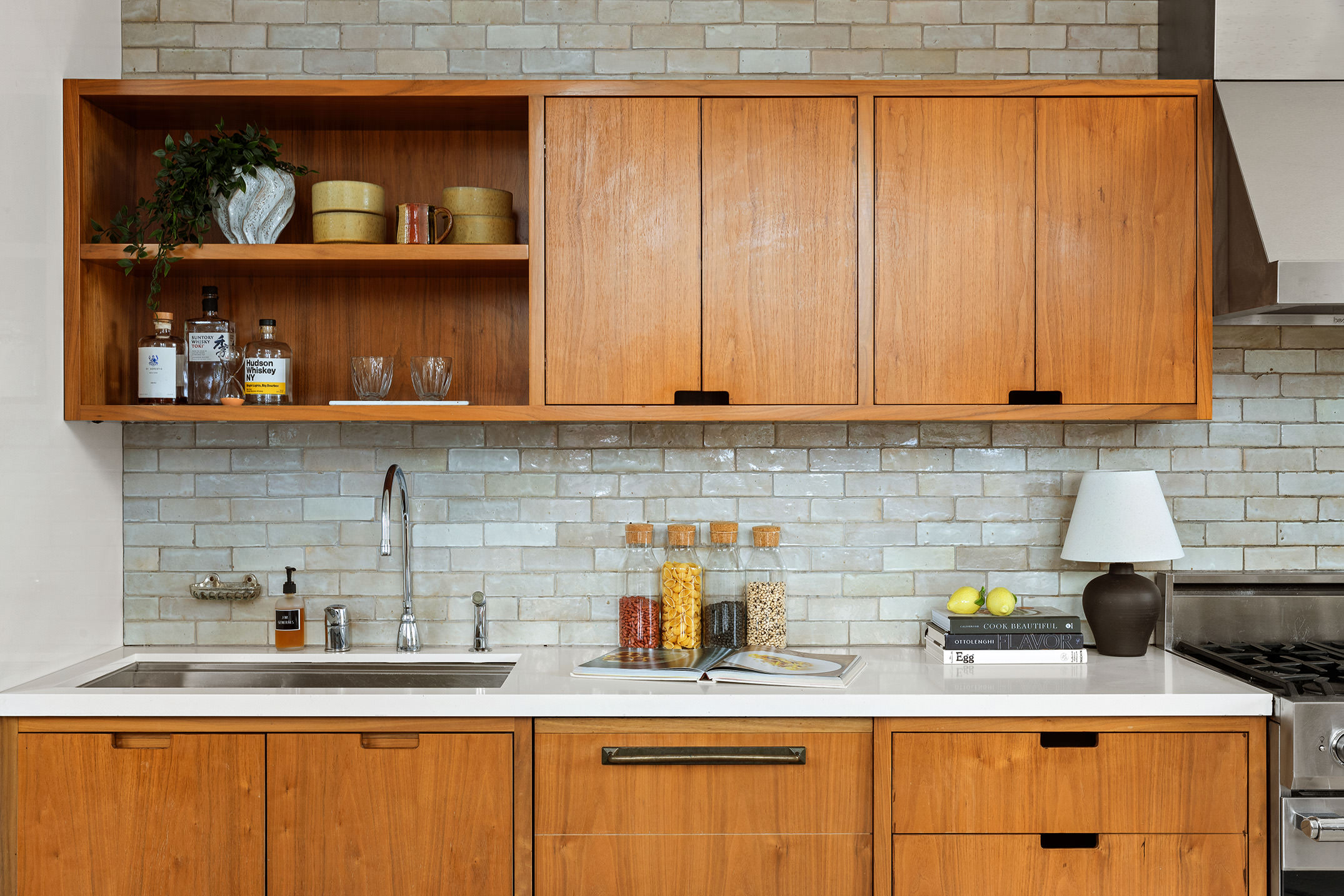 2 Cornelia Street, Unit 506 Manhattan, NY 10014 - Photo 3 of 11 a kitchen with stainless steel appliances granite countertop a sink a stove and cabinets