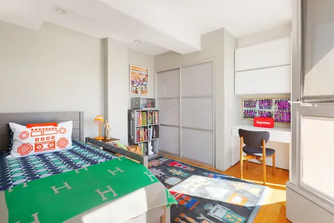 a living room with a gaming machine and a table