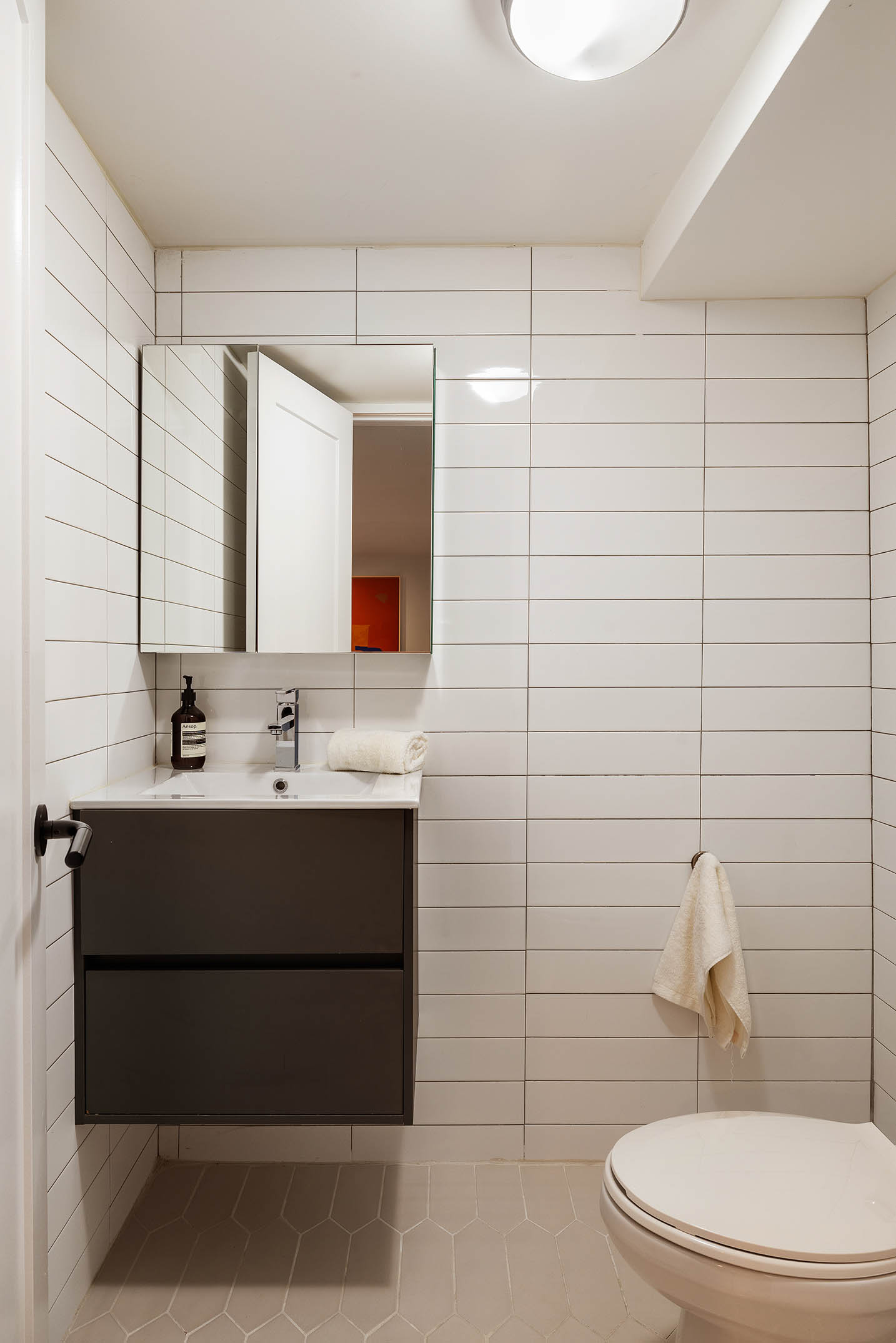 1025 Lorimer Street, Unit PARLOR Brooklyn, NY 11222 - Photo 19 of 21 a bathroom with a sink mirror vanity and toilet