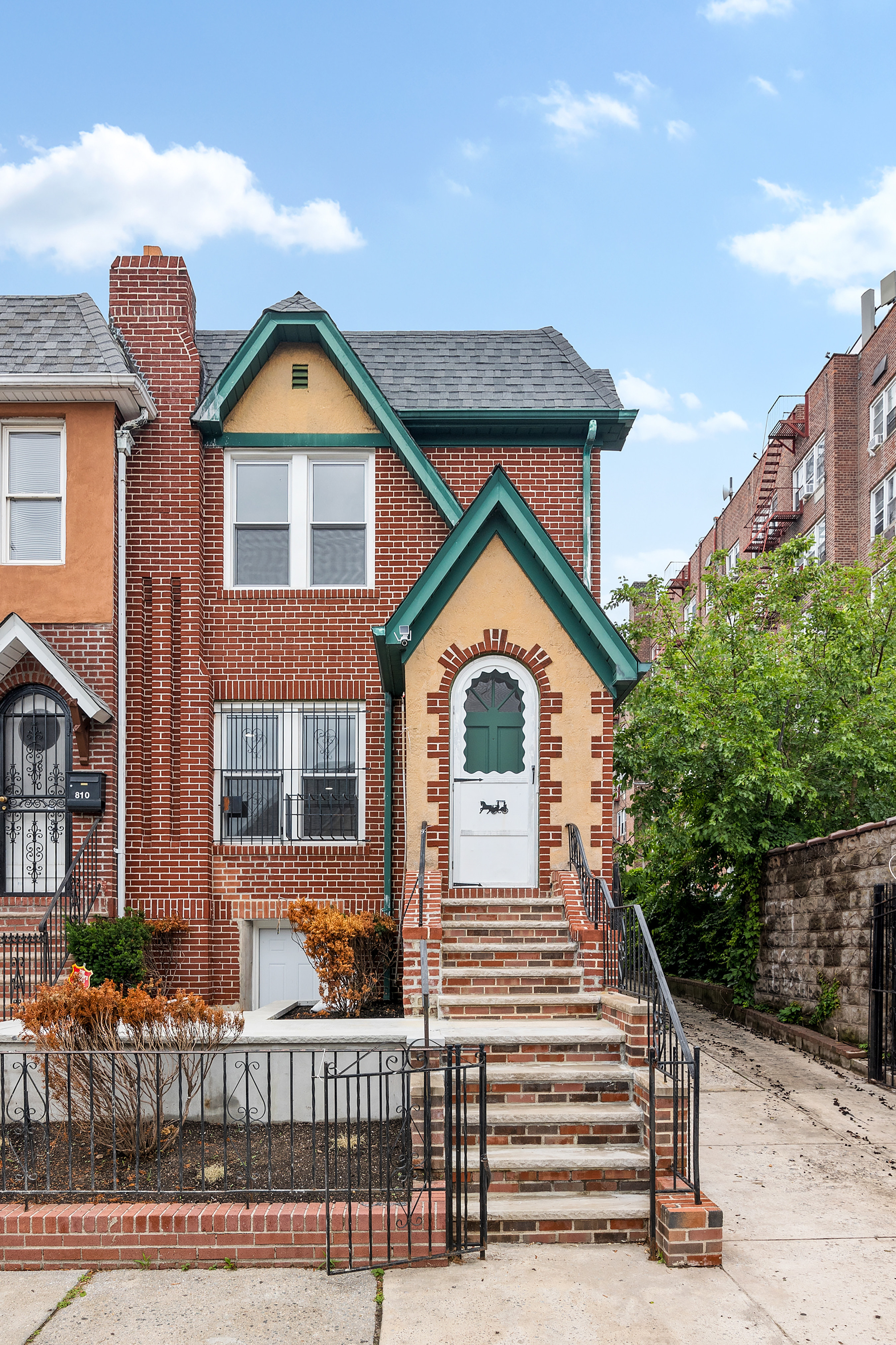 806 East 48th Street Brooklyn, NY 11203 - Photo 12 of 13 a front view of a house with balcony