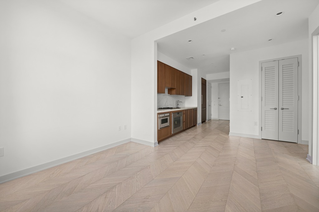115 York Street, Unit 4J Brooklyn, NY 11201 - Photo 4 of 9 a view of kitchen with stainless steel appliances cabinets