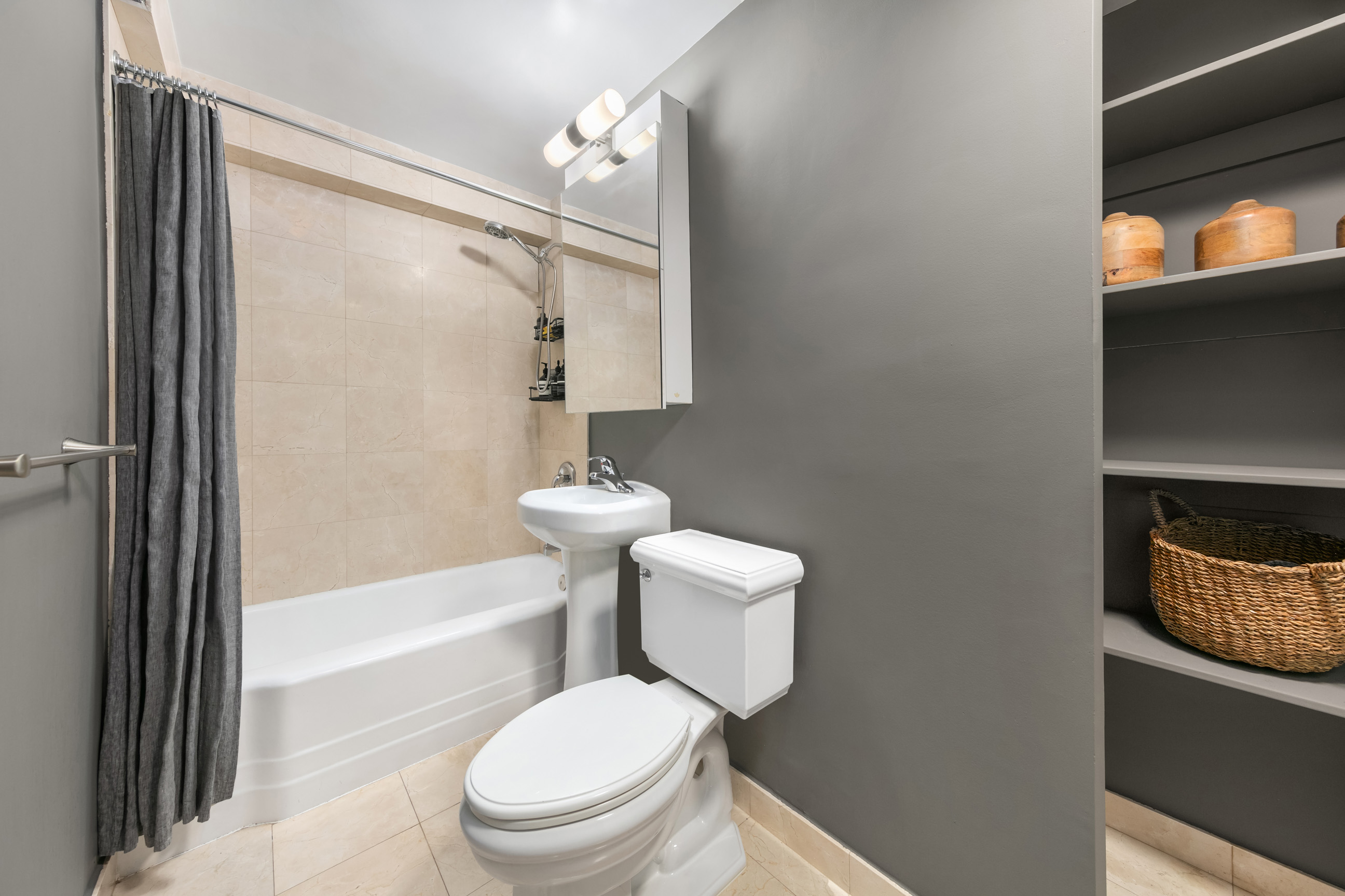 420 East 64th Street, Unit E3A Manhattan, NY 10065 - Photo 6 of 8 a white toilet sitting next to a bath tub