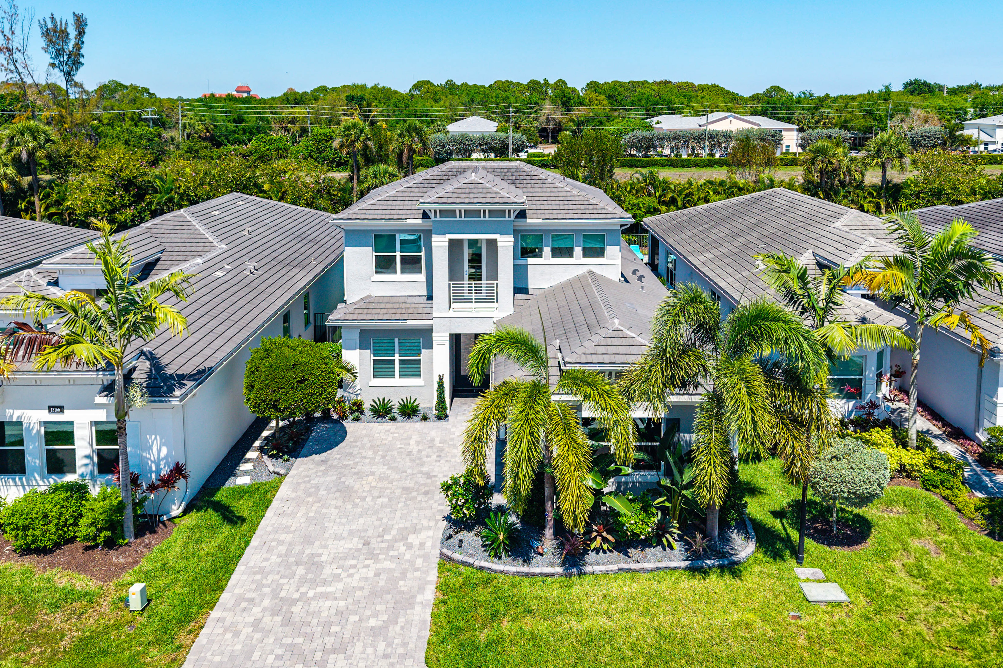 13172 Whistler Mountain Road Delray Beach, FL 33446 - Photo 2 of 38 a front view of house with a garden
