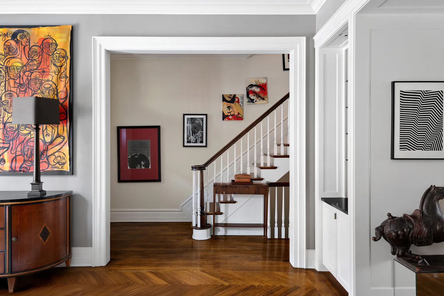 a spacious bedroom with a bed and wooden floor