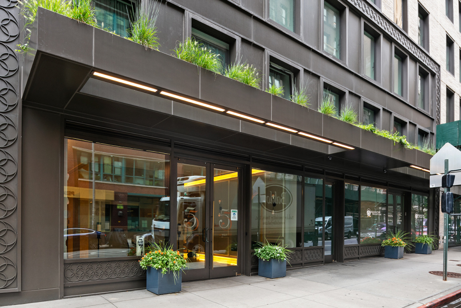 55 West 17th Street, Unit 701 Manhattan, NY 10011 - Photo 17 of 20 a front view of a building with glass windows