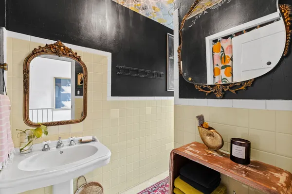 a bathroom with a sink and a mirror