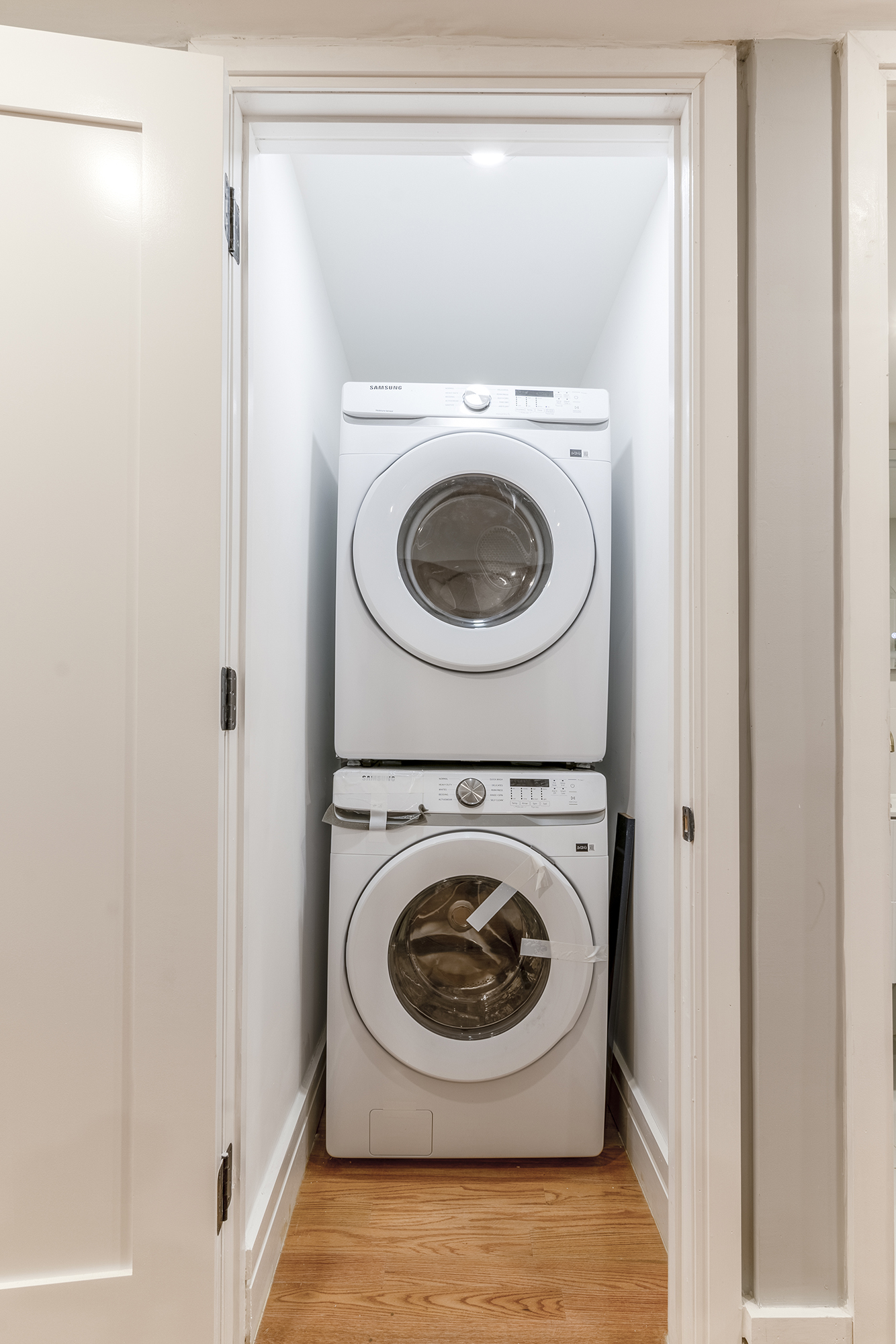 192 Weirfield Street, Unit ONE Brooklyn, NY 11221 - Photo 4 of 8 a utility room with dryer and washer