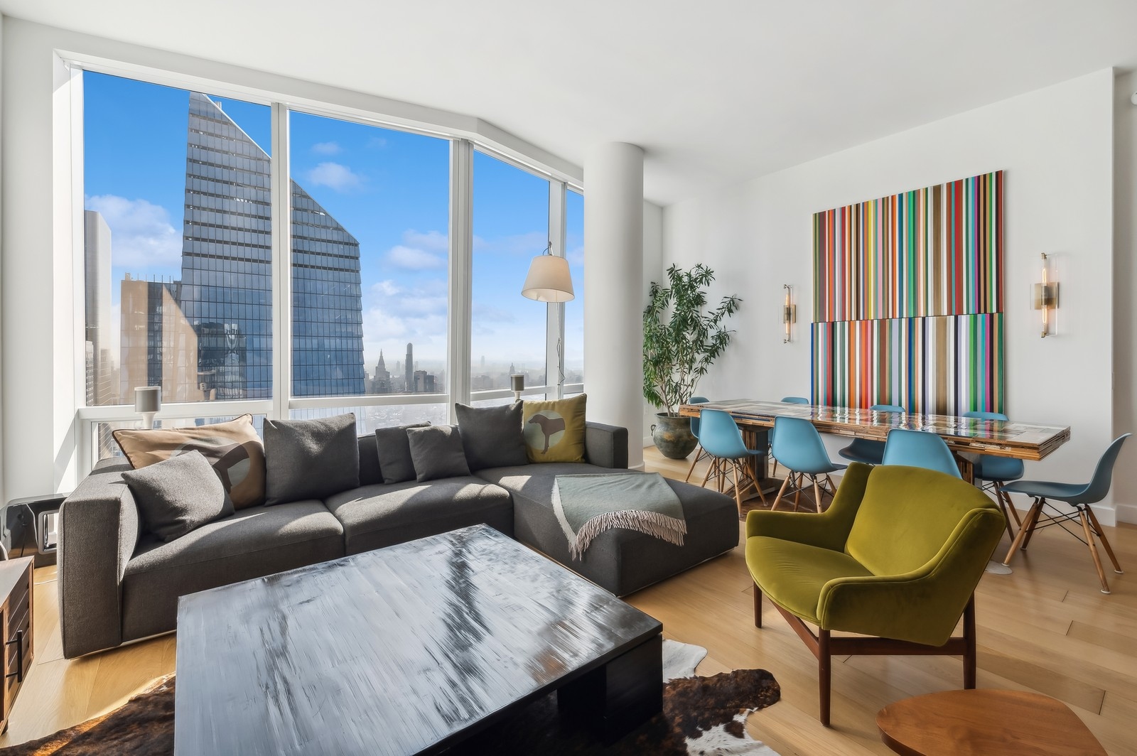 15 Hudson Yards, Unit 74F Manhattan, NY 10001 - Photo 2 of 13 a living room with furniture and a large window