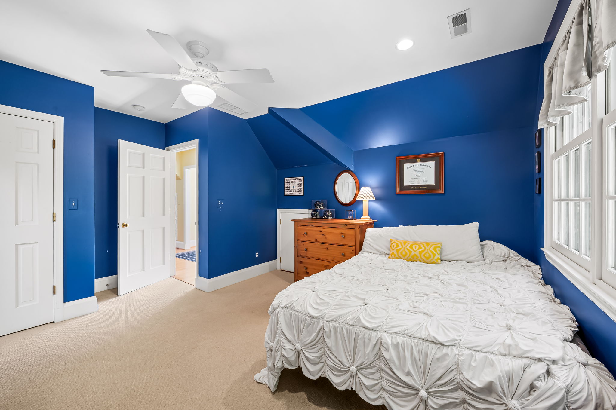 910 Army Road Towson, MD 21204 - Photo 36 of 62 a bedroom with a bed and a chandelier