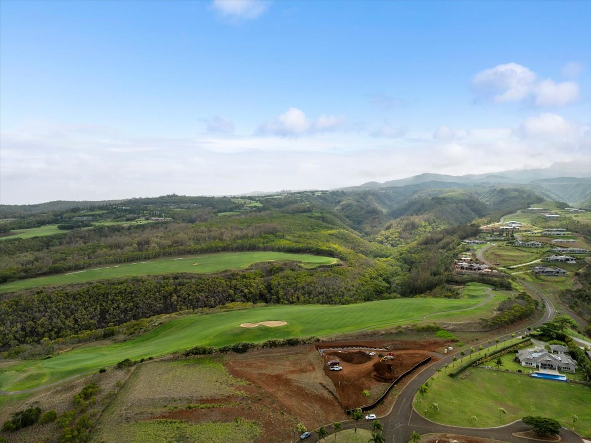 Uki'uki Loop Lahaina, HI 96761 - Photo 26 of 37 an aerial view of a golf course with a lake view