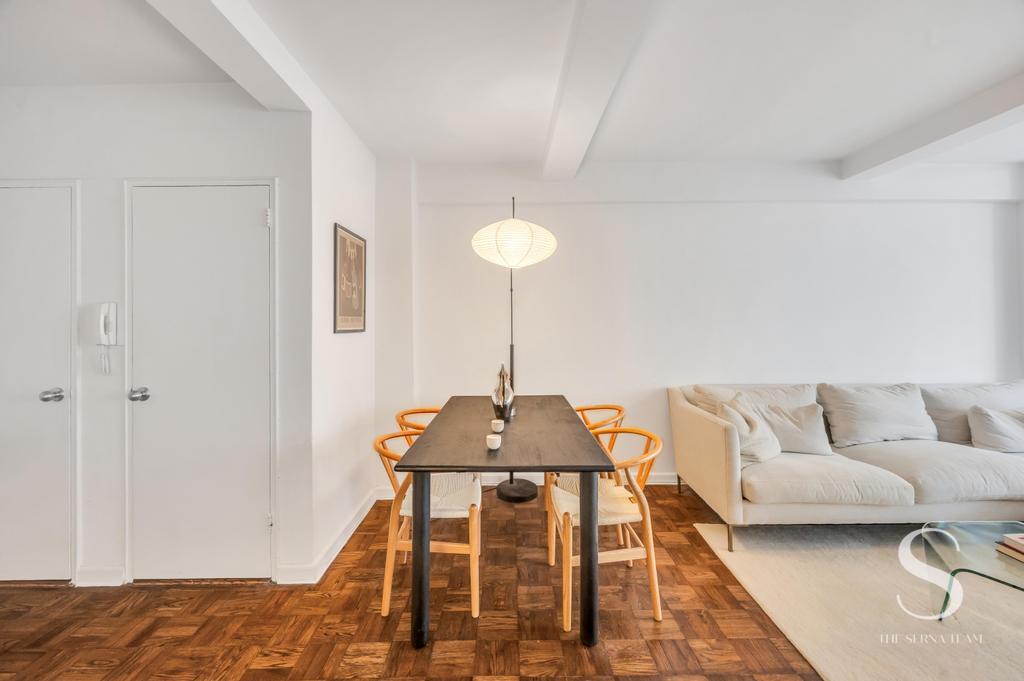 7 Lexington Avenue, Unit 5E Manhattan, NY 10010 - Photo 8 of 27 a living room with furniture and a rug