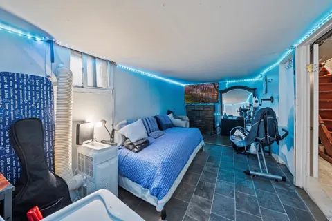 a living room with furniture a rug and a fireplace