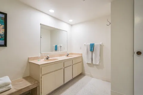 a bedroom with a large bed and a large window