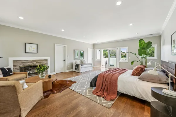 a spacious bedroom with a bed and a couch