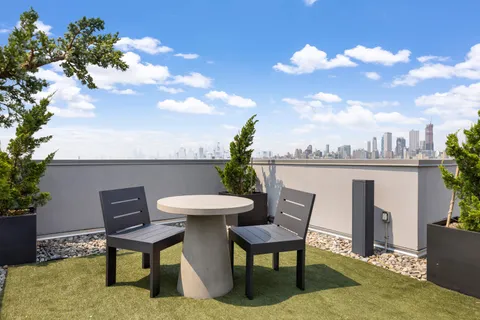 a view of a chairs and table in the patio