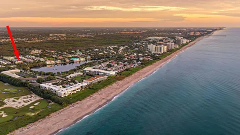 an aerial view of city and lake