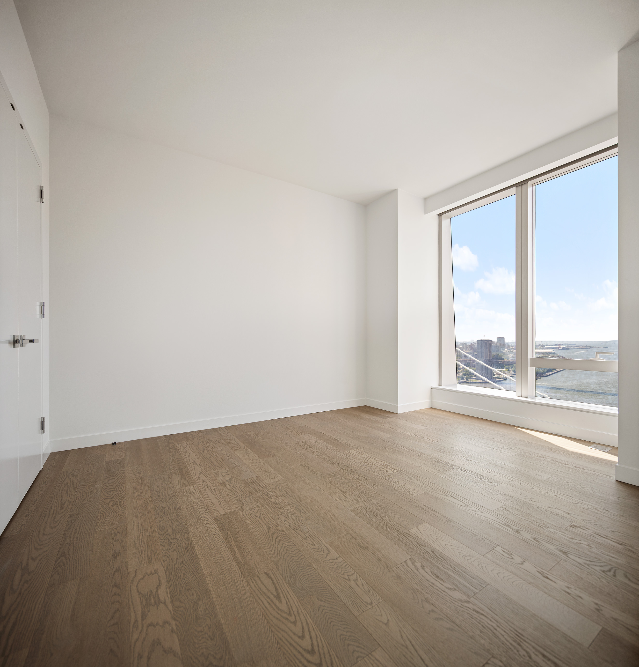 252 South Street, Unit 28C Manhattan, NY 10002 - Photo 7 of 10 a view of an empty room with a window