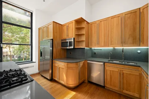 a view of room with window and lounge chair