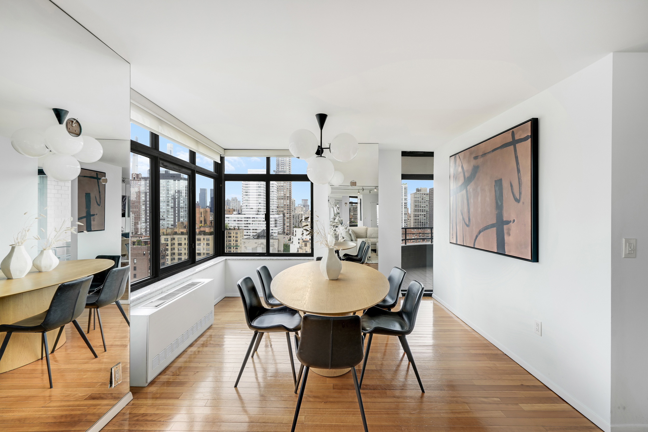 400 East 70th Street, Unit 2402 Manhattan, NY 10021 - Photo 3 of 18 a living room with furniture and a large window