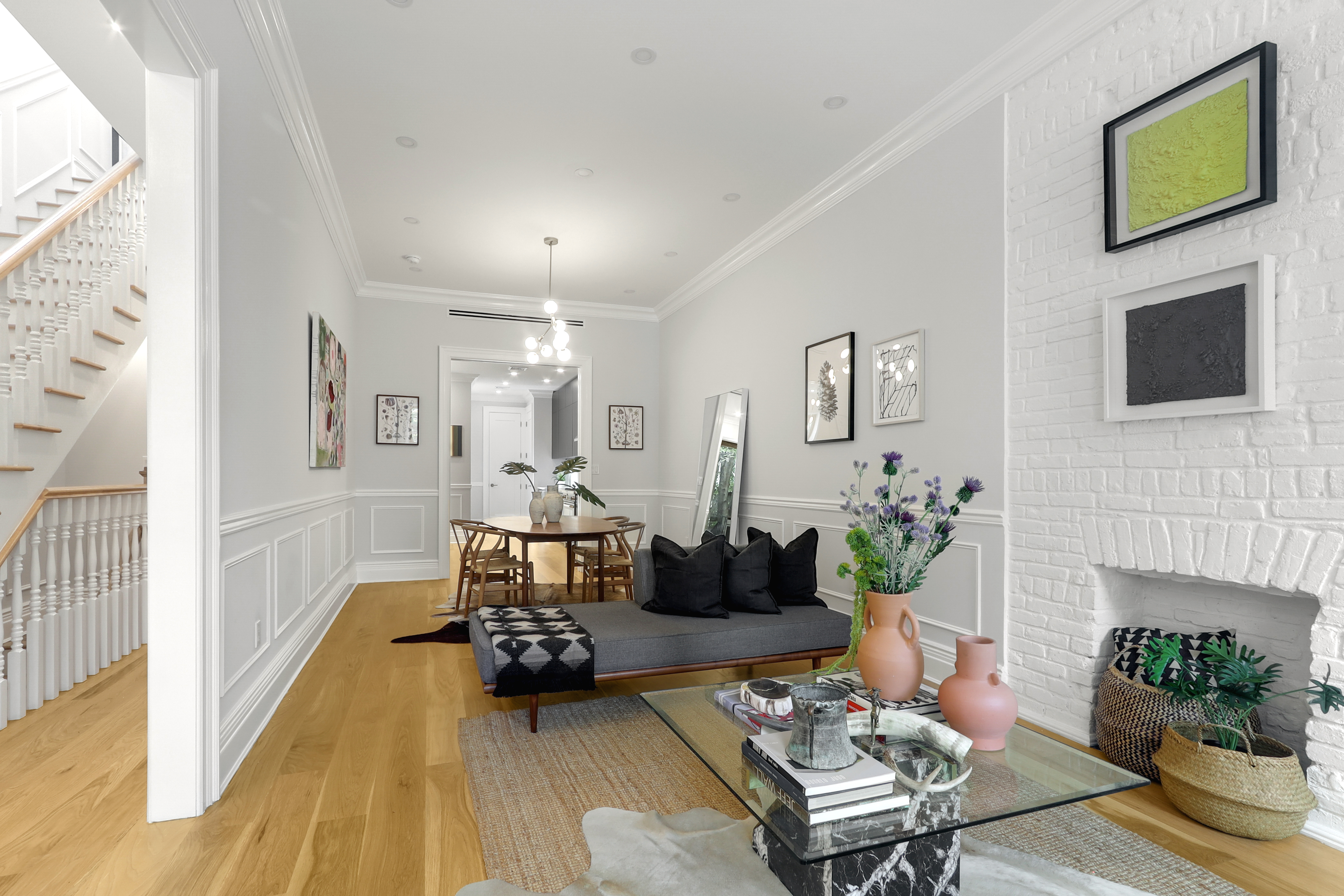 220 Lewis Avenue Brooklyn, NY 11221 - Photo 4 of 22 a living room with furniture a fireplace and a flat screen tv