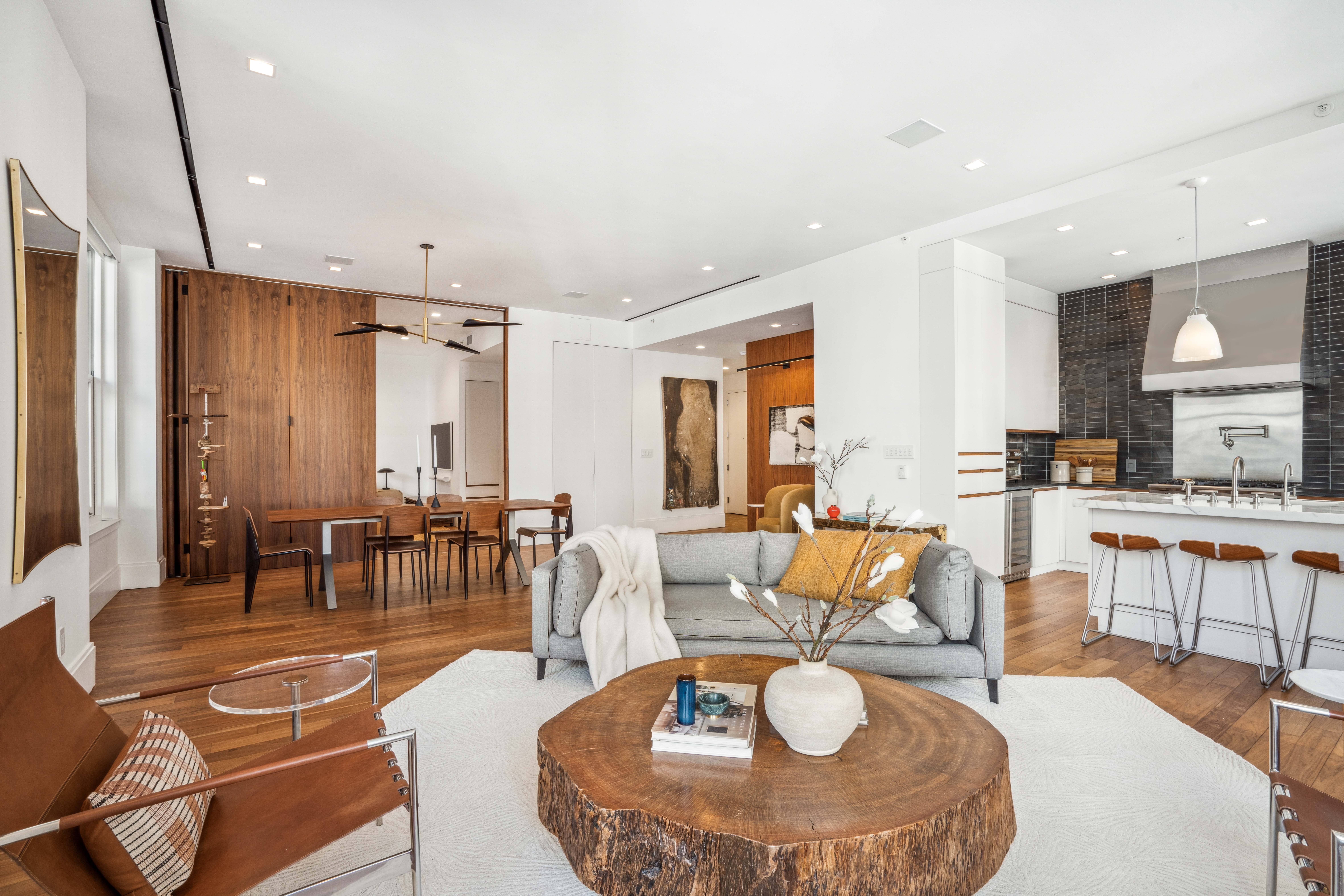 141 5th Avenue, Unit 4C Manhattan, NY 10010 - Photo 2 of 16 a living room with furniture kitchen view and a large window