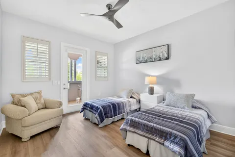 a bedroom with two beds and a couch