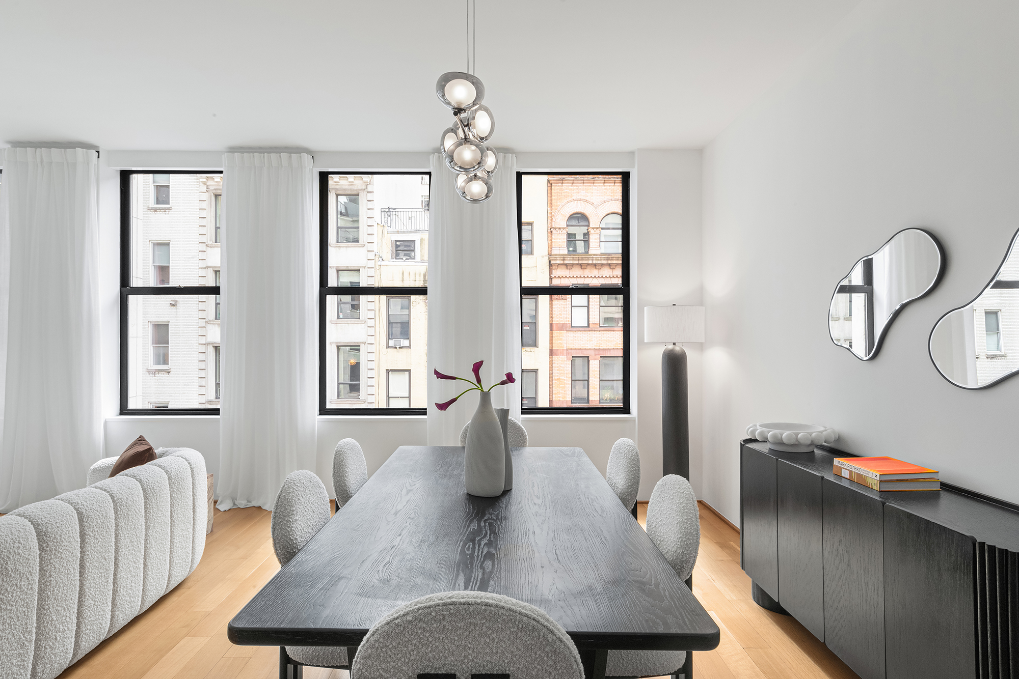71 Reade Street, Unit 4D Manhattan, NY 10007 - Photo 3 of 15 a view of a dining room with furniture window and wooden floor