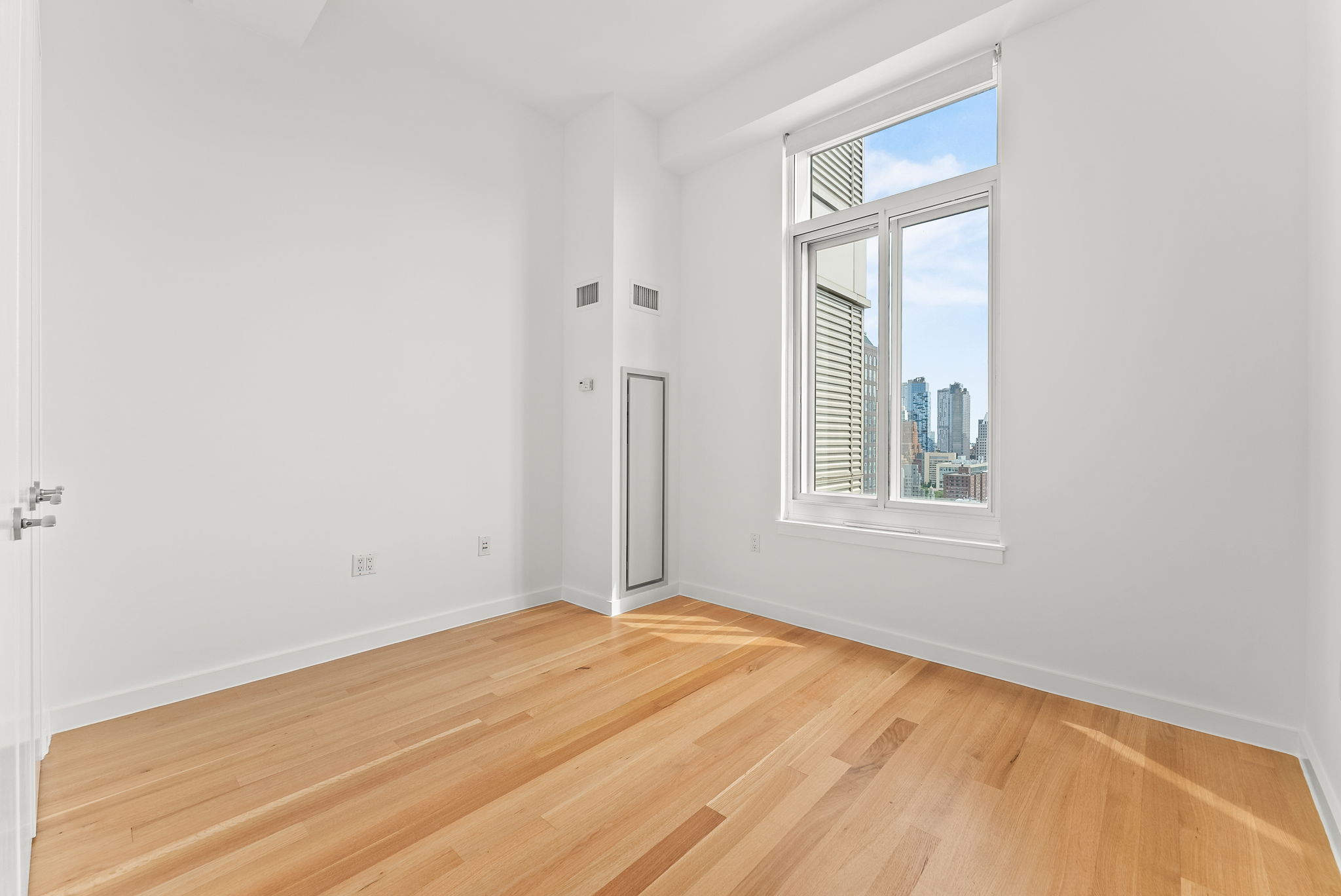 85 Adams Street, Unit 21A Brooklyn, NY 11201 - Photo 9 of 18 a view of an empty room with a window