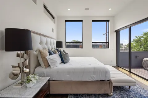 a bedroom with a bed and window