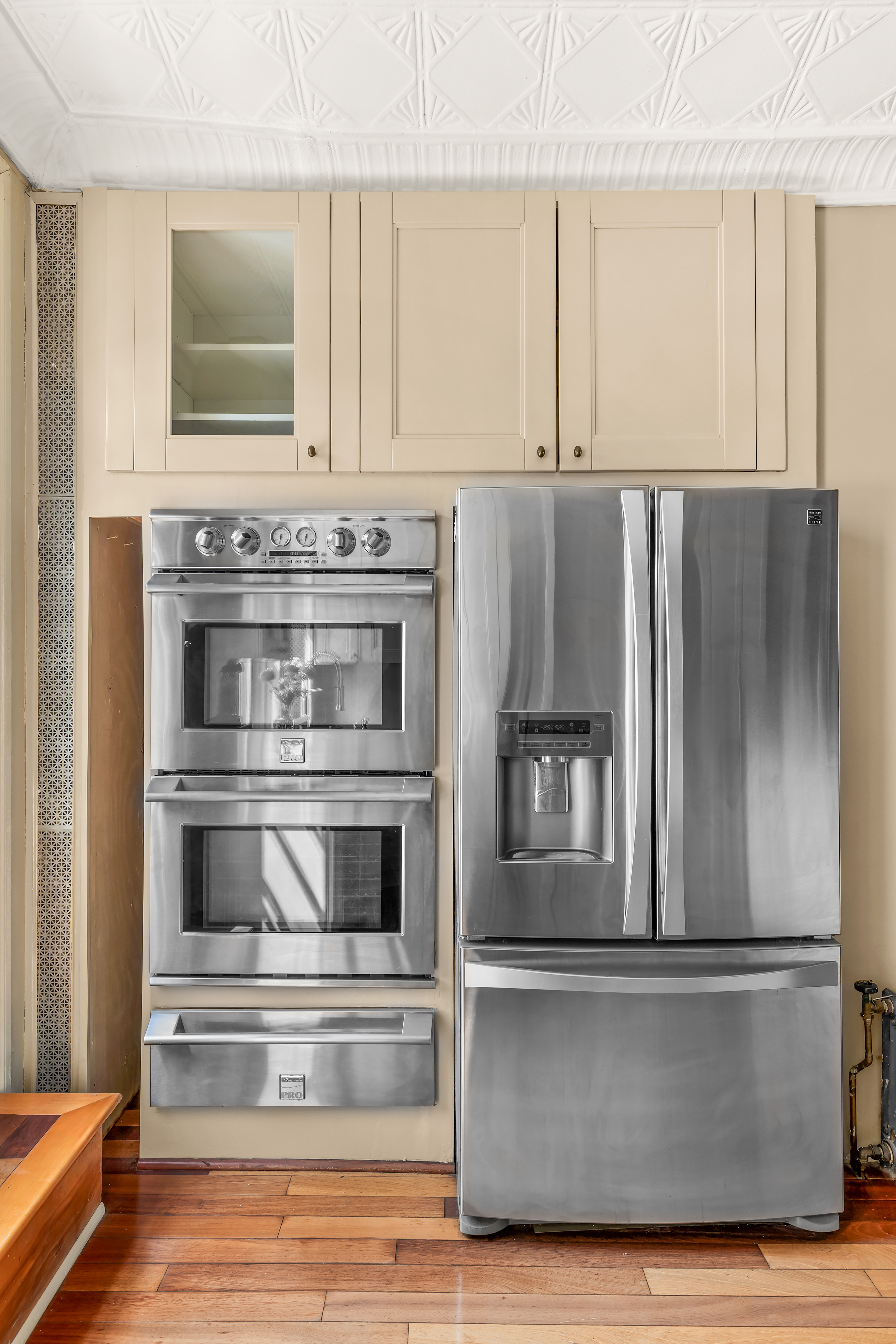 124 Carroll Street, Unit 2 Brooklyn, NY 11231 - Photo 11 of 13 a kitchen with granite countertop white cabinets and stainless steel appliances