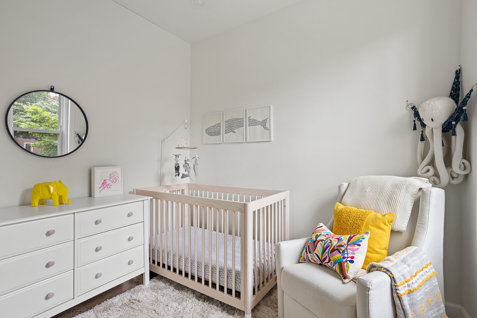 72-17 34th Avenue, Unit 1P Queens, NY 11372 - Photo 9 of 14 a bedroom with furniture and a window