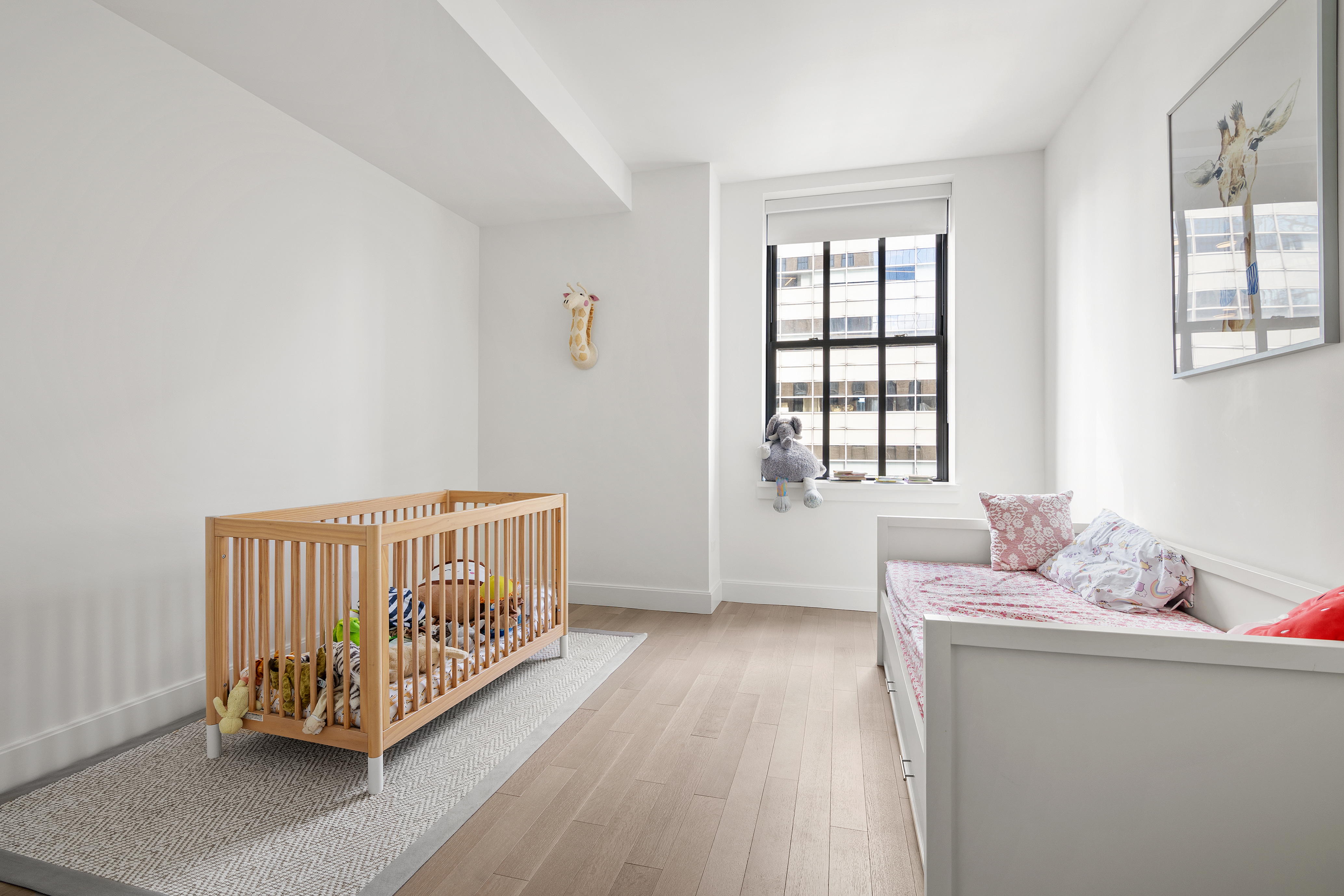 100 Barclay Street, Unit 16D Manhattan, NY 10007 - Photo 7 of 14 a bedroom with furniture and a window