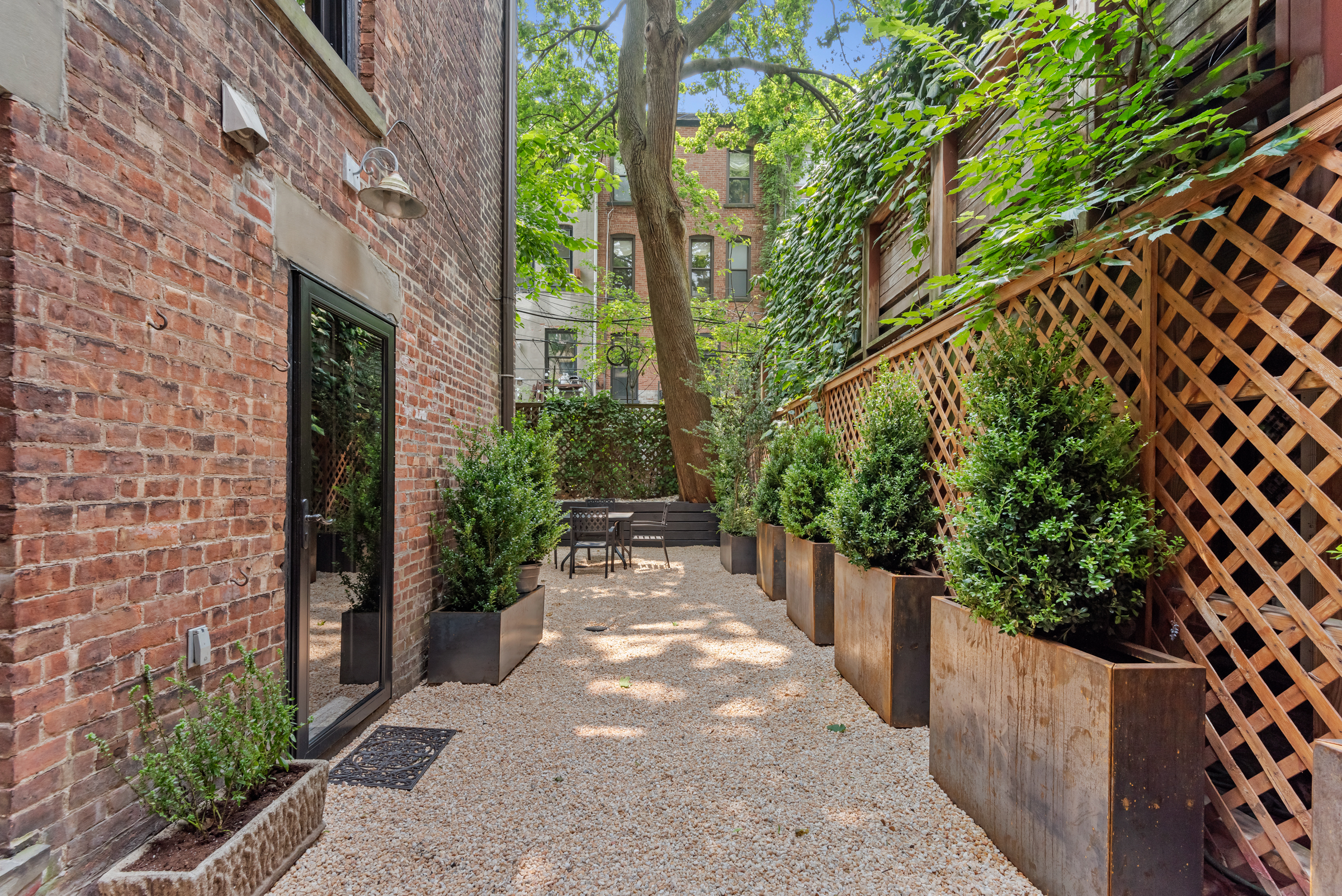 616 2nd Street Brooklyn, NY 11215 - Photo 7 of 19 a view of a pathway with plants and wooden fence