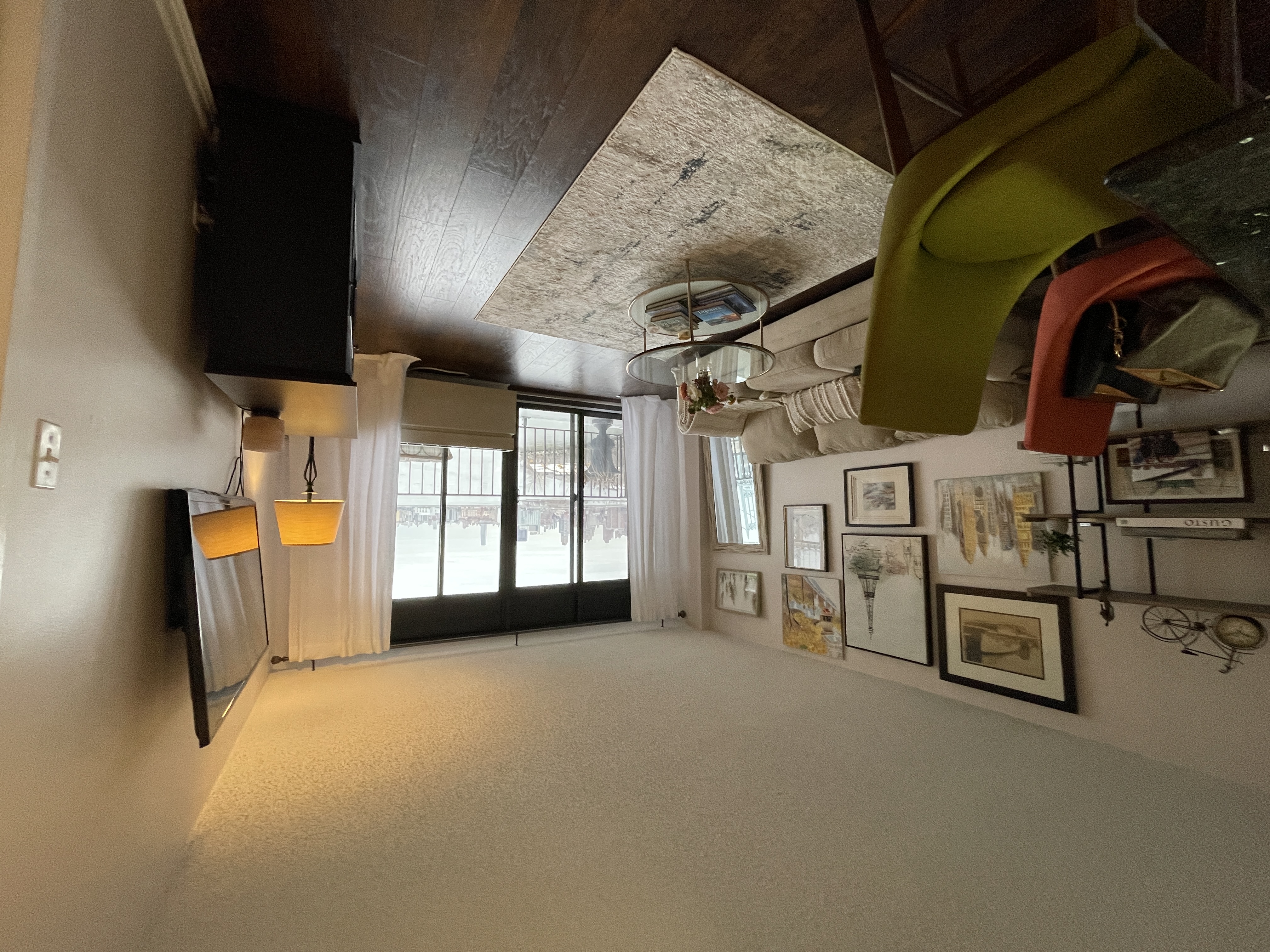 25-40 Shore Boulevard, Unit 8T Queens, NY 11102 - Photo 4 of 23 a living room with furniture and a flat screen tv