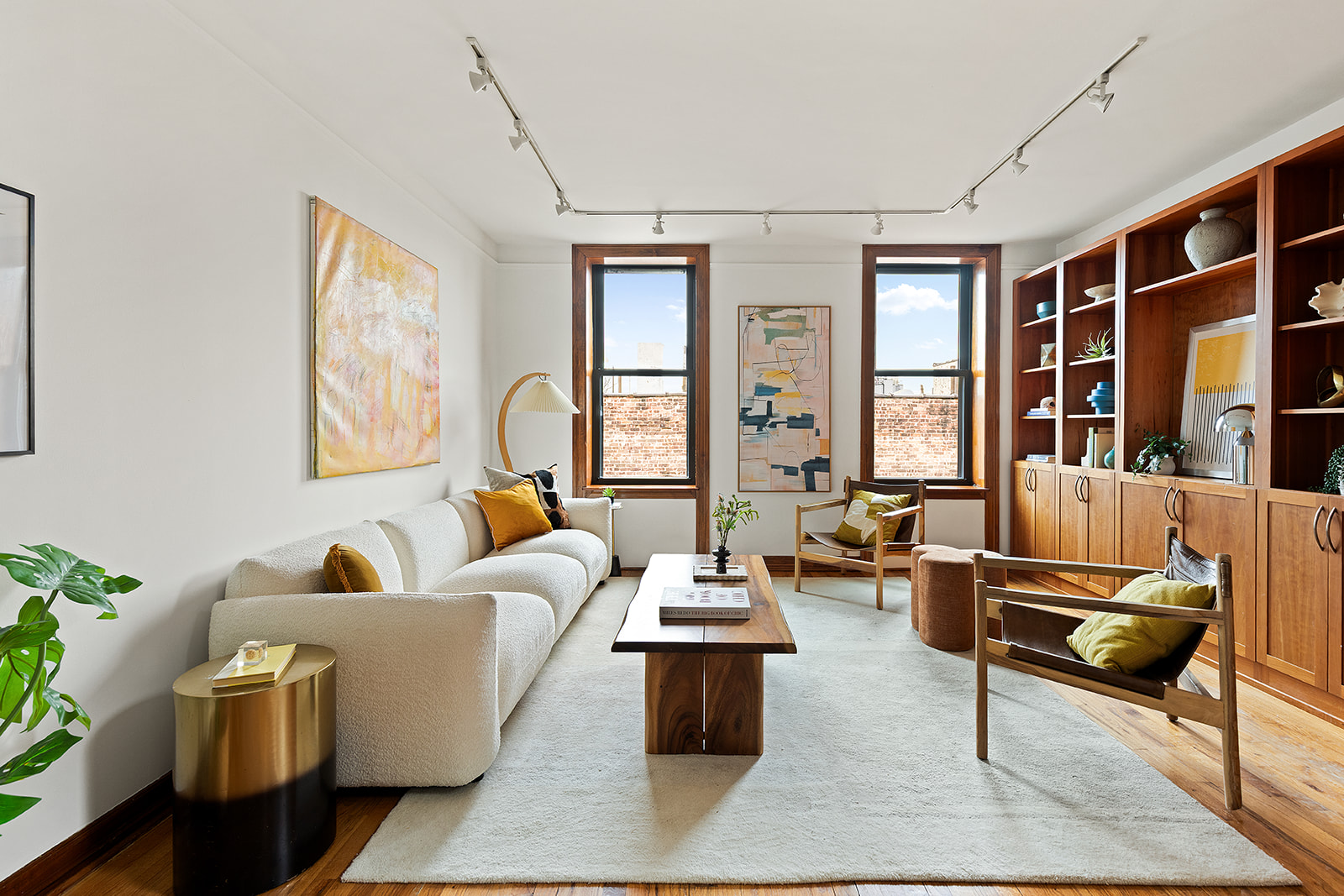 375 Lincoln Place, Unit 4F Brooklyn, NY 11238 - Photo 2 of 10 a living room with furniture and floor to ceiling windows