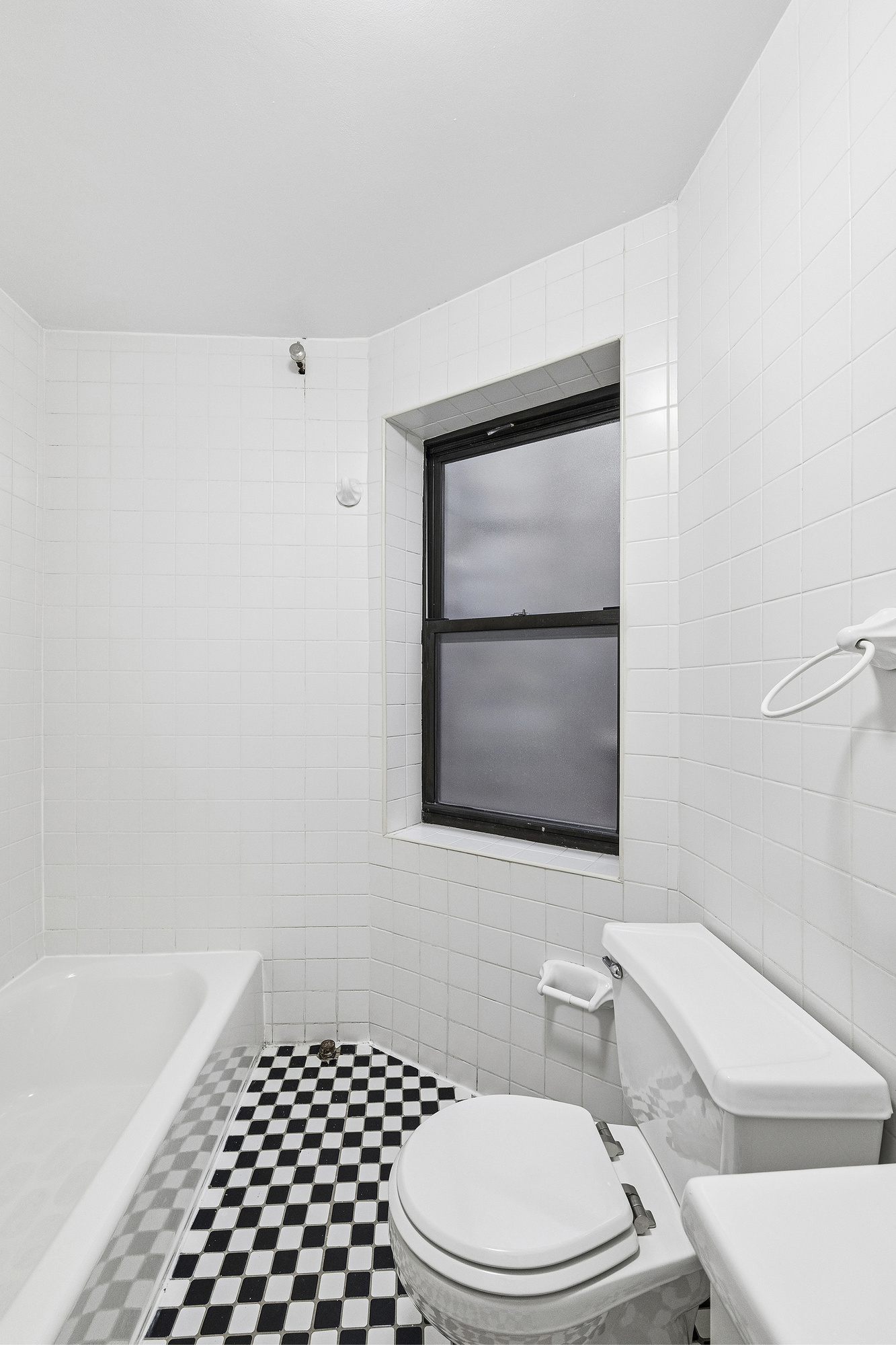5 Cornelia Street, Unit 5B Manhattan, NY 10014 - Photo 6 of 7 a bathroom with a toilet a sink and a shower