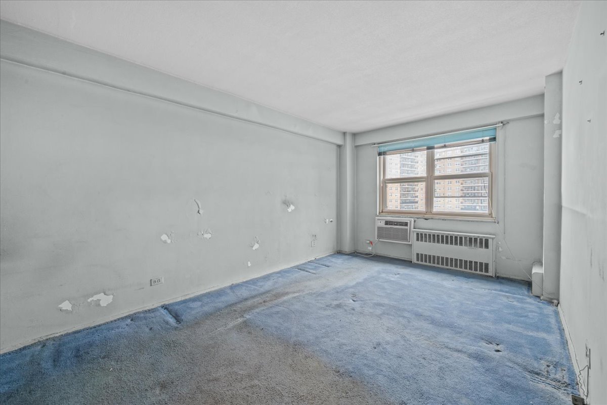 448 Neptune Avenue, Unit 16K Brooklyn, NY 11224 - Photo 13 of 28 a view of an empty room with a window